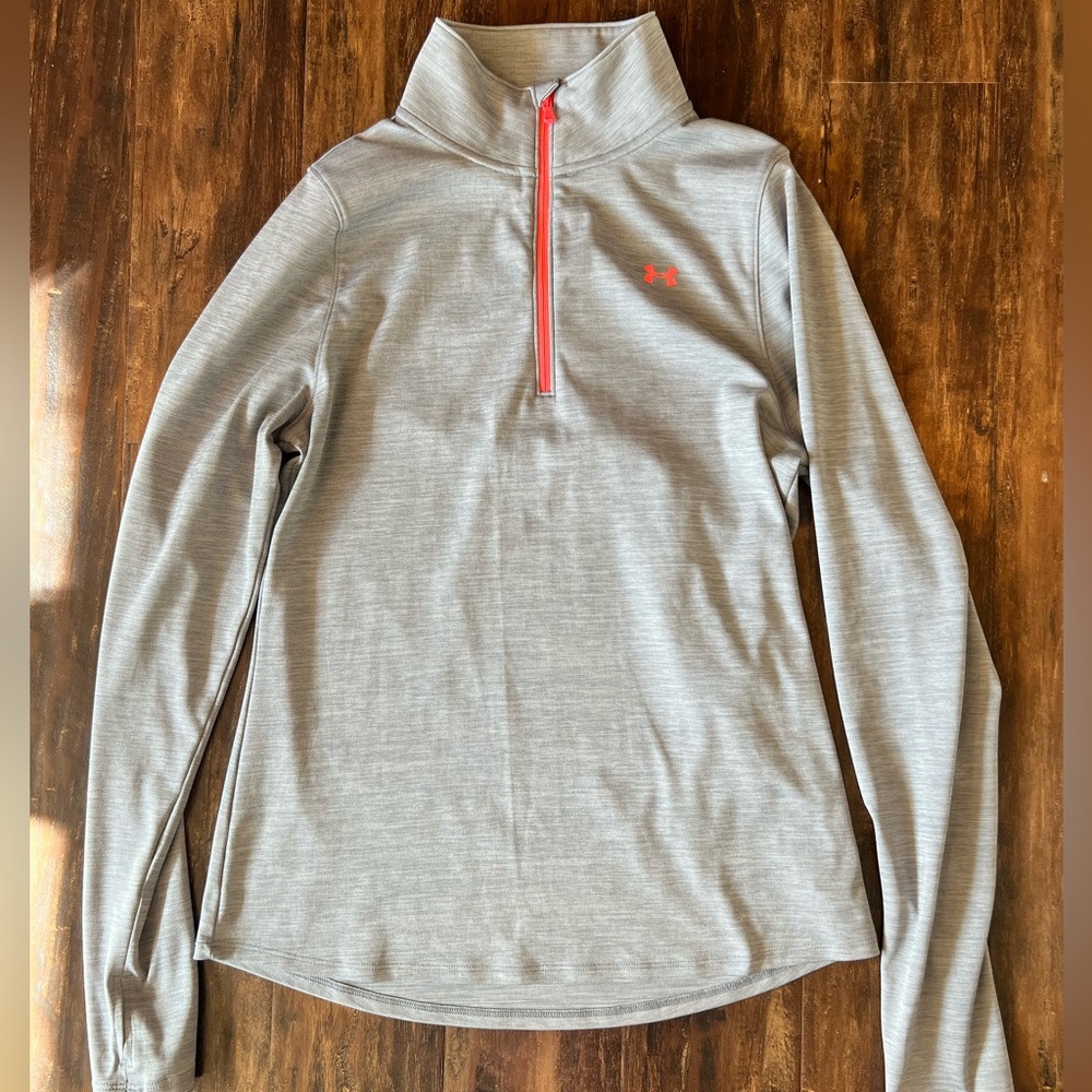 Under Armour semi fitted heat gear half zip pullover. Size M